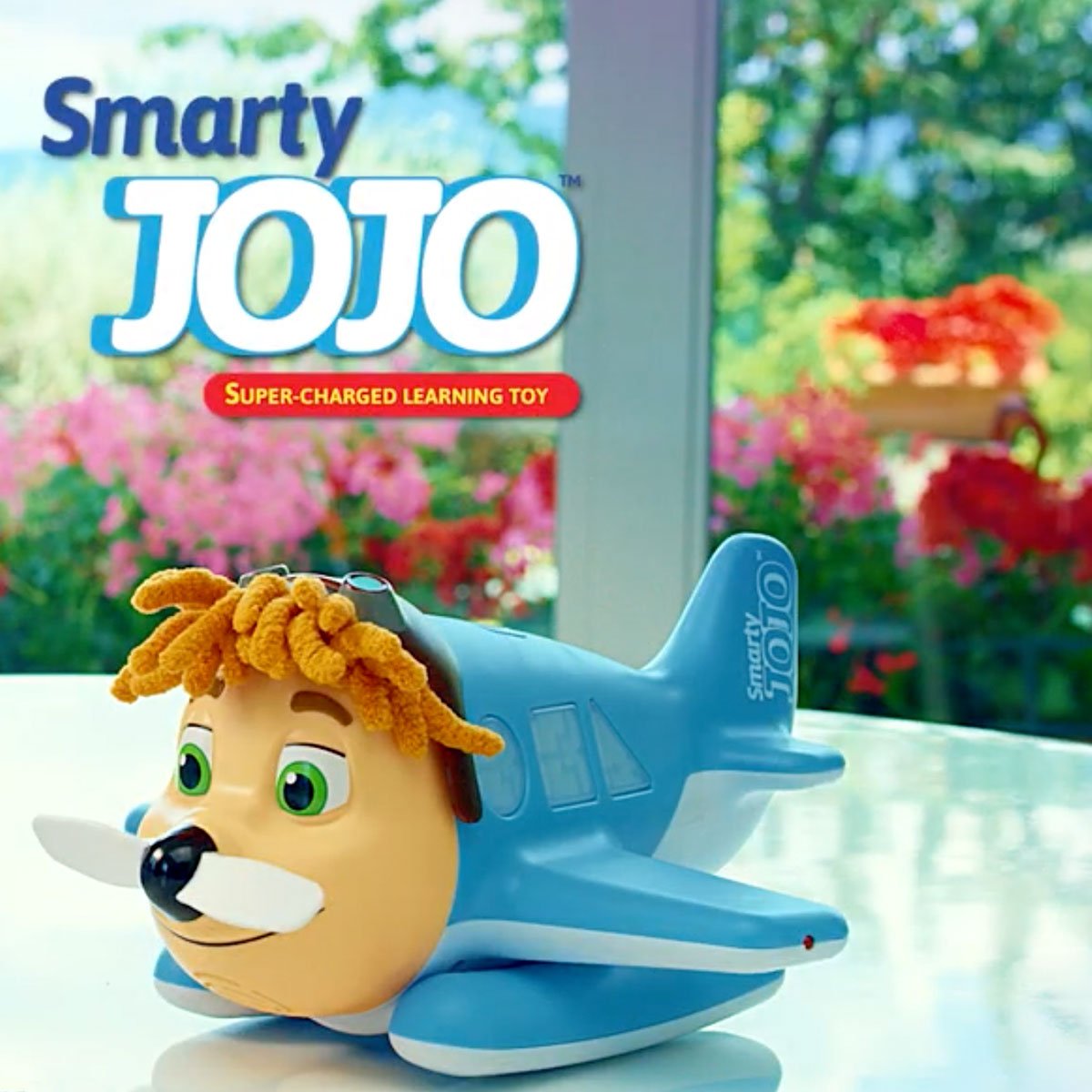 צעצוע חכם ™ Smarty JOJO מונח על אדן חלון